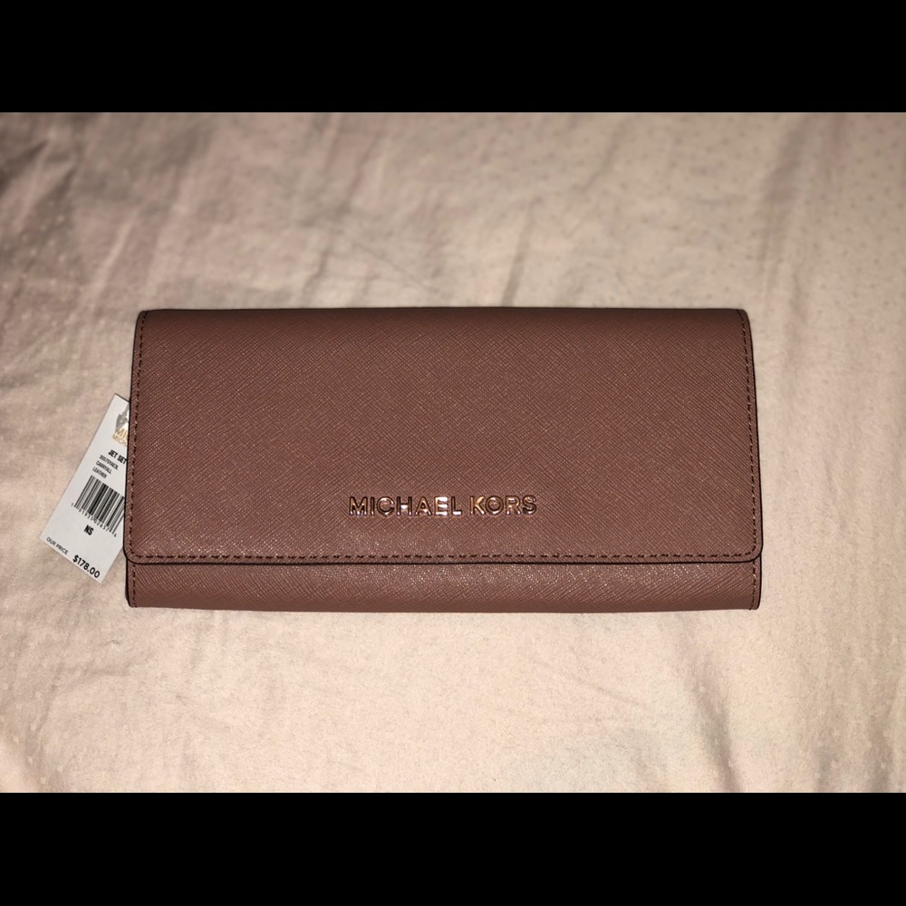 Never been used MK dusty mauve wallet.